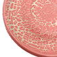Detail picture of fired plate with pink crawl glaze on dark clay. Crawling texture when fired to cone 5 or 6.