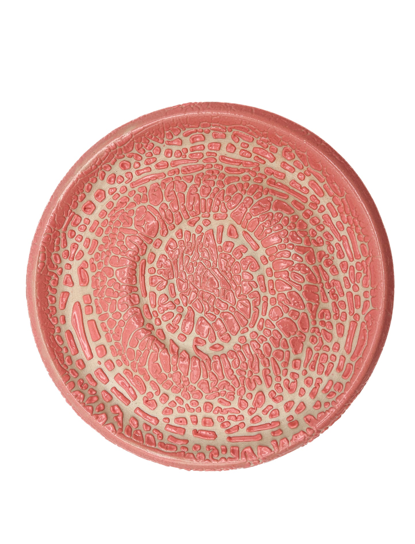 Fired plate with pink crawl glaze on dark clay. Crawling texture when fired to cone 5 or 6.