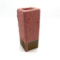 Fired test column for red puff glaze on dark clay. Cloud-like texture when fired to cone 5 or 6.