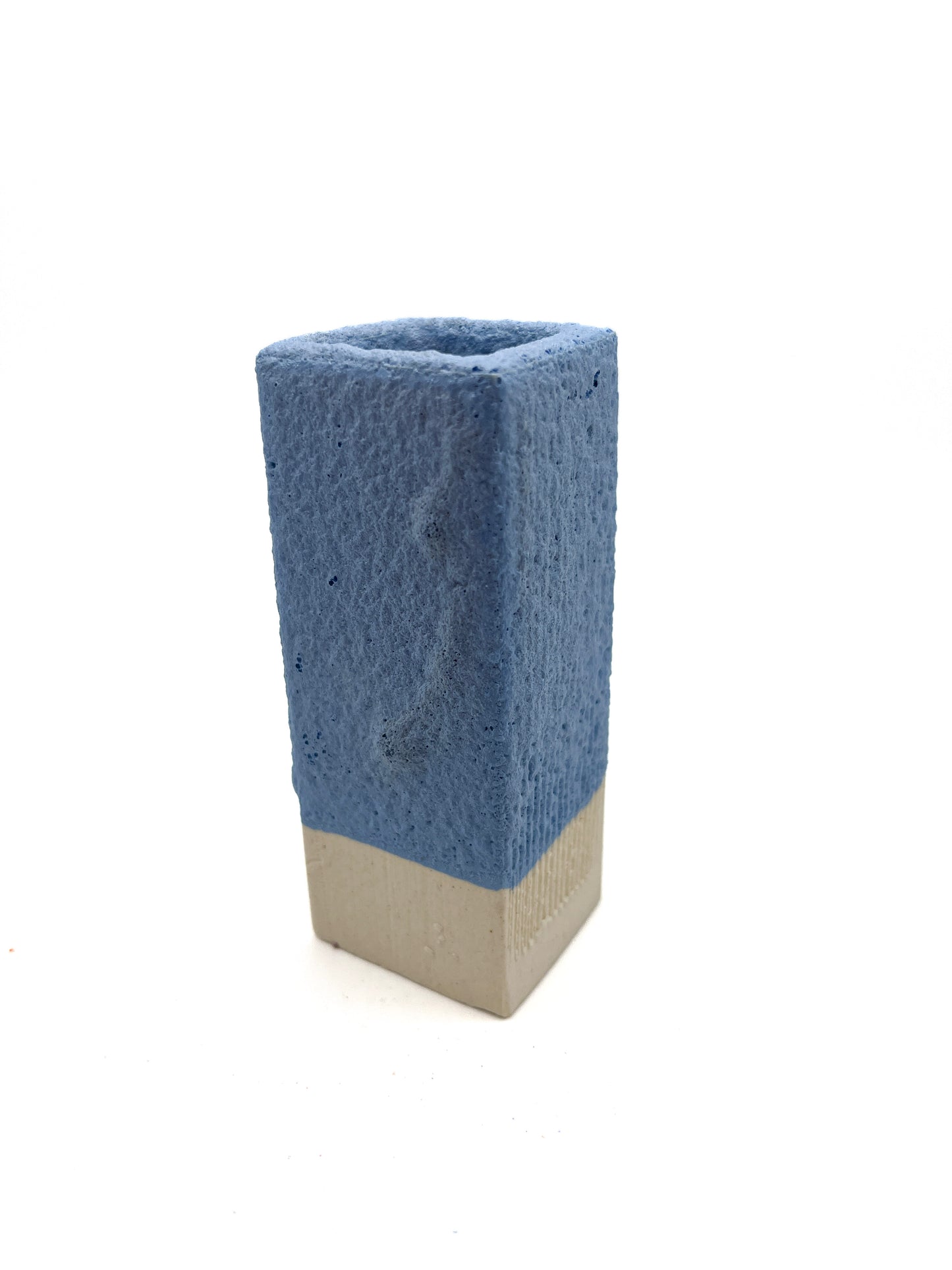 Fired test column for blue mini-puff glaze on light clay. Fuzzy texture when fired to cone 5 or 6.
